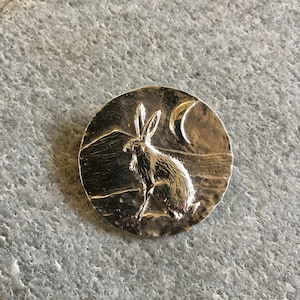 Hare with crescent moon and mountain brooch