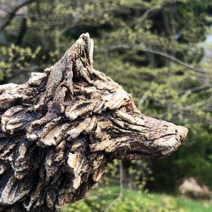 Wolf sculpture in ceramic stoneware hand sculpted by Paul Szeiler