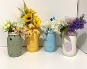 Mason Jar Decorated centerpieces, Distressed Mason Jars with Floral Arrangement great for home or office.