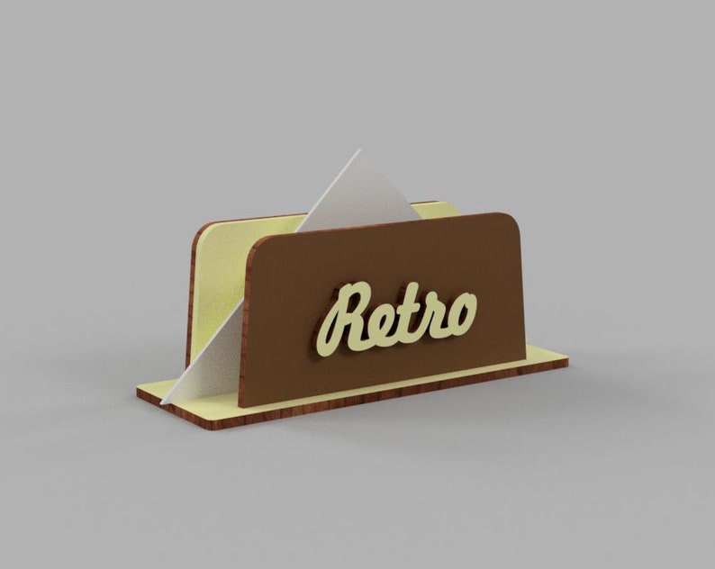 May include: A brown and yellow wooden napkin holder with the word "Retro" in yellow lettering.