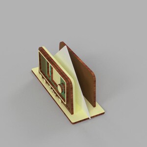May include: A wooden napkin holder shaped like a vintage radio with a yellow and brown color scheme. The radio has a dial with the word "Retro" on it.