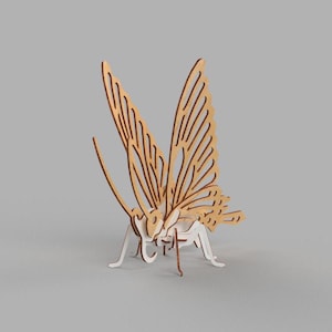 May include: A wooden butterfly model with intricate details and a light brown colour. The butterfly is posed with its wings spread out.