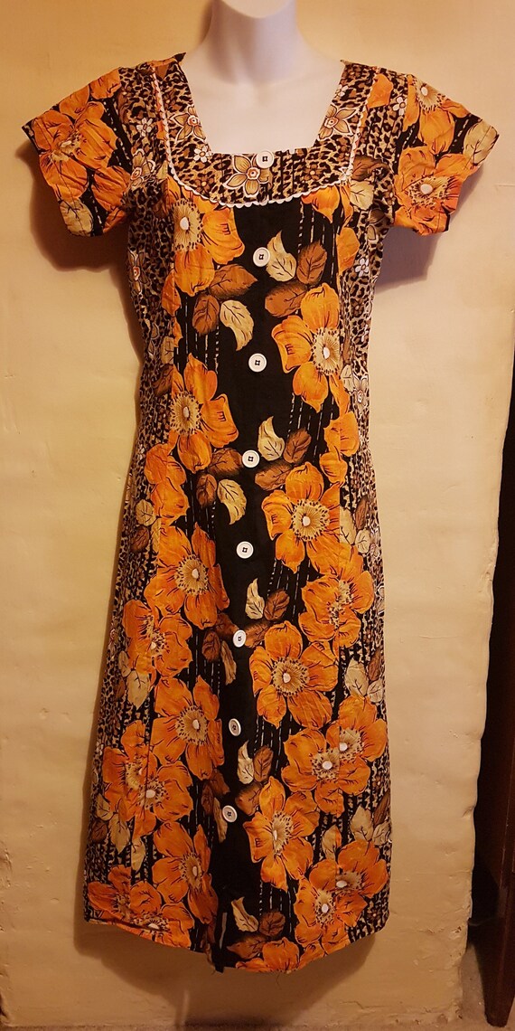 black dress orange flowers