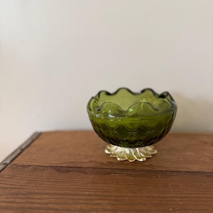 May include: A set of three ceramic mugs with a speckled, matte finish in cream, light grey, and dark grey. Each mug has a simple, minimalist design and a rounded handle.