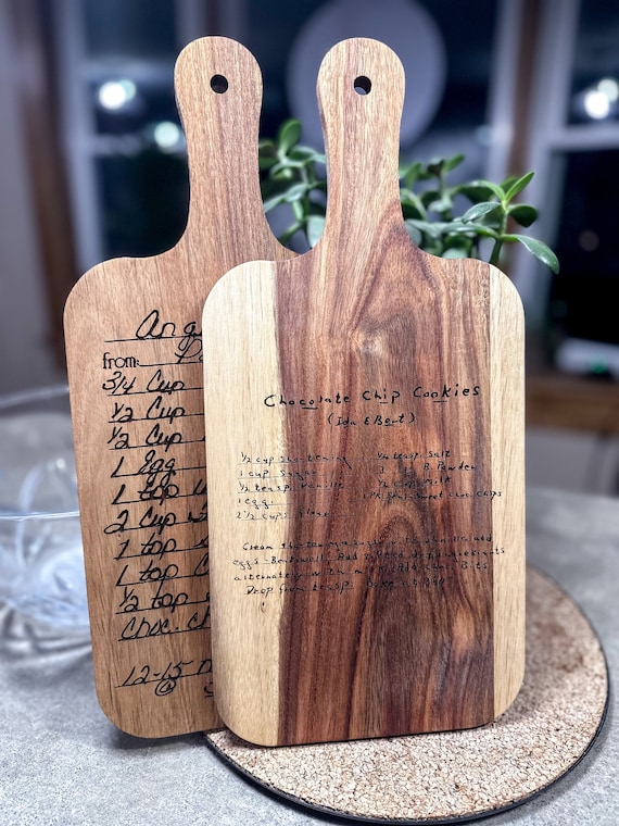 A cutting board that doubles as a keepsake — your actual family recipe engraved right on the wood, making grandma's secret lasagna immortal.