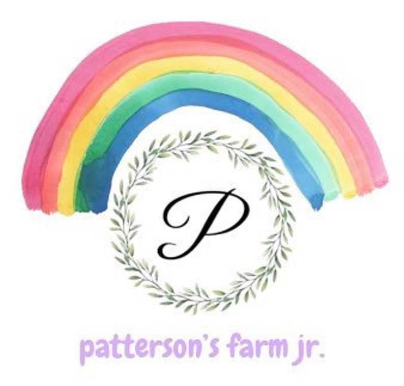 May include: A watercolor rainbow with a green wreath and the letter "P" in the center. The text "patterson's farm jr." is below the wreath.