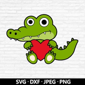 May include: A cartoon illustration of a green alligator holding a red heart. The alligator has large, round eyes and a friendly expression. The image includes the text "SVG • DXF • JPEG • PNG" at the bottom.