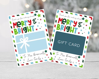 May include: Two white gift cards with a red, green, and blue "Merry & Bright" design. The cards have a space for a gift card and a space for a message. The message reads "Thank you for making school... To Mrs. Bramwell, Love Emily x".