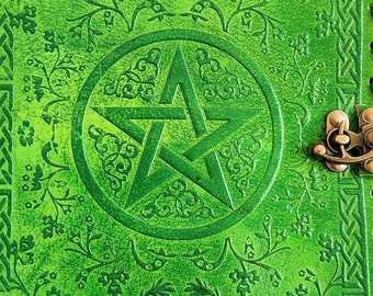 May include: Green leather journal with a pentacle design embossed on the front cover. The cover has a Celtic knot border and a brass clasp.