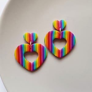 Rainbow striped heart shaped earrings, handmade statement jewelry, indie aesthetic festival accessories, retro fashion, unique gifts for her