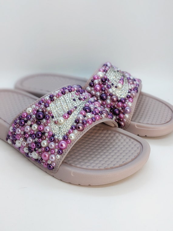purple and white nike slides