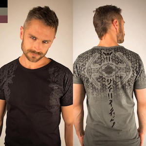 May include: Black and gray short-sleeve t-shirts. One shirt is black with a gray patterned design on the shoulders. The other is gray with a black graphic on the back. The graphic appears to be a spaceship.