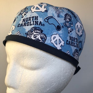 May include: A blue and white patterned surgical scrub hat with the text "North Carolina" and the UNC logo.
