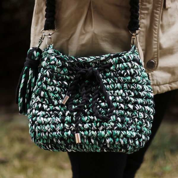 Stylish women's black and green crochet purse in eco zpaghetti yarn in boho style for summer.