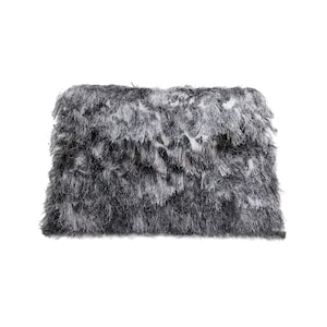 May include: A rectangular, fluffy pillow in shades of gray and white. The pillow has a shaggy, textured surface, creating a soft and inviting appearance. The color palette is neutral, making it suitable for various interior design styles.