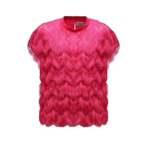 May include: A pink short-sleeved shirt with a fringe design.