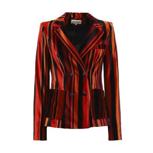 May include: A double-breasted blazer with vertical stripes in shades of red, orange, and black. The blazer has two front pockets, black buttons, and a notched lapel. The garment is made of a velvet-like material.