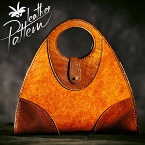 May include: A brown leather handbag with a triangular shape and a circular handle. The bag has a textured surface and is made of multiple pieces of leather.