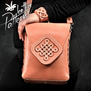 May include: A light brown leather crossbody bag with a decorative knot design on the front flap. The bag has a white stitch detail around the edges and a long adjustable strap.