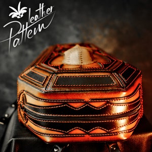 May include: A brown leather backpack with black and orange stitching. The backpack is shaped like a coffin and has a skull design on the front.