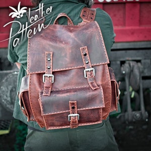 May include: A brown leather backpack with multiple buckles and pockets. The backpack has a distressed look and is made of high-quality leather.
