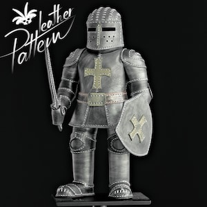 May include: A handcrafted, gray leather knight figurine, complete with a helmet, armor, shield, and sword. The armor features a cross design and is detailed with stitching. The text "leather Pattern" is in the upper left corner.
