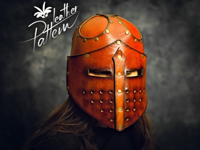 May include: A brown leather helmet featuring a central vertical ridge, horizontal eye slits, and a perforated lower section. The helmet is constructed with multiple leather panels joined by brass-colored rivets. The text "Pattern Leather" is visible.