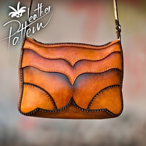 May include: A brown leather shoulder bag with a decorative stitched design. The bag has a flap closure and a long strap.