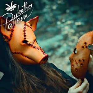 A close up portrait of a woman in the woods, wearing a handcrafted creepy pig leather Halloween mask