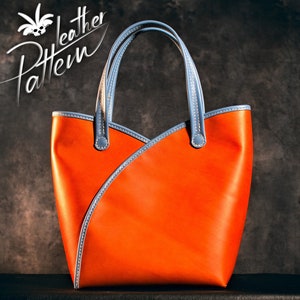 May include: Orange leather tote bag with light blue accents and handles. The bag features a unique design with a diagonal seam and the text "Leather Pattern" in a script font.