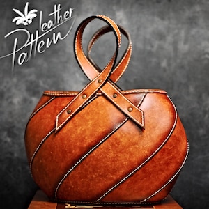 May include: A brown leather handbag with a unique woven design and a top handle. The bag has a rustic, vintage look.
