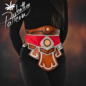 May include: A brown leather belt with silver accents and a red fabric insert. The belt has a decorative design with a pointed shape in the center.