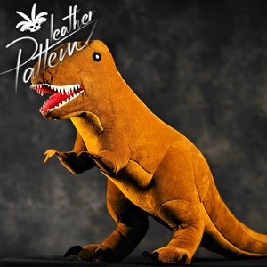 May include: A plush brown dinosaur toy with a red mouth and white teeth. The dinosaur is standing on a black surface. The text "Leather Pattern" is visible in the background.