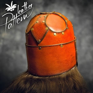 May include: A tan leather helmet featuring a rounded crown with overlapping panels, secured by metallic rivets along the seams and a horizontal band around the base. The text "Leather Pattern" is visible in the upper left corner of the image.