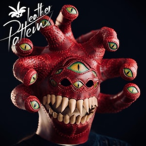 May include: A red leather mask with multiple green and yellow eyes and sharp white teeth. The mask has a textured surface and is designed to resemble a monster. The text "Leather Pattern" is written in white script.