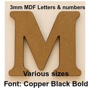 May include: A brown MDF letter "M" with the text "3mm MDF Letters & numbers", "Various sizes", and "Font: Copper Black Bold". The letter is a light brown colour and has a textured surface.