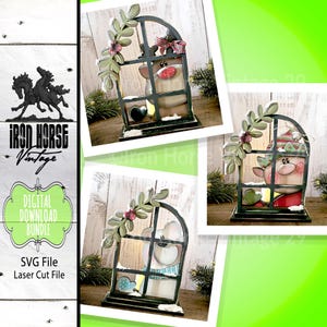 May include: A digital download bundle featuring SVG files for laser cutting. The image showcases a decorative Christmas-themed window scene with a reindeer figure, adorned with festive details. The design includes a window frame, foliage, and snow accents.