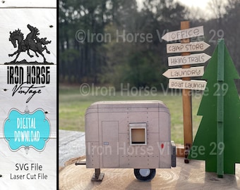May include: A digital download SVG file for a laser cut model of a vintage camper trailer, a pine tree, and a wooden signpost with directions to the office, camp store, hiking trails, laundry, and boat launch. The signpost reads "Iron Horse Vintage 29".