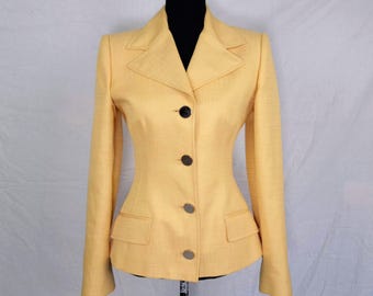 May include: A yellow blazer with a notched collar, four button closure, and two front pockets.