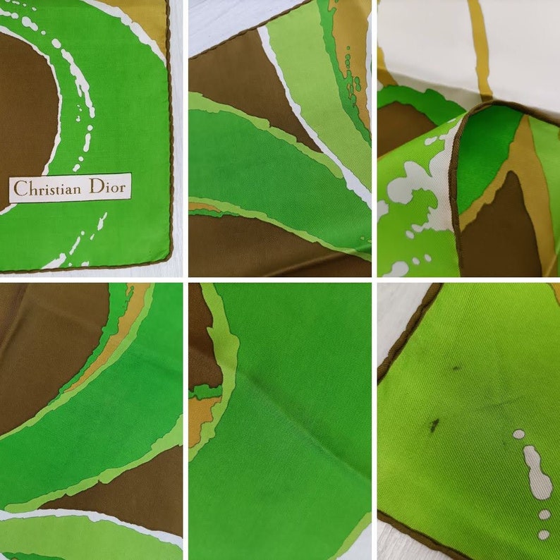 Op de afbeelding: Een groene, bruine en witte zijden sjaal met een abstract ontwerp. De sjaal heeft de tekst "Christian Dior" erop gedrukt.