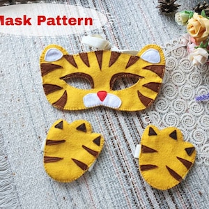 May include: A felt tiger mask and two paw hand puppets. The mask is yellow with brown stripes and white ears. The paws are yellow with brown stripes and black claws.