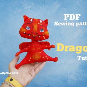 May include: PDF sewing pattern for a red dragon toy with yellow accents. The pattern includes a tutorial.  "Dragon Tutorial" is written in yellow text on a blue background.
