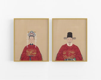 May include: Two framed portraits of a man and woman in traditional Chinese clothing. The woman is wearing a red robe with gold embroidery and a pearl headdress. The man is wearing a red robe with gold embroidery and a black hat. Both portraits have a beige background.
