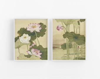 May include: Two framed prints of traditional Japanese art depicting pink and white lotus flowers with green leaves on a beige background.