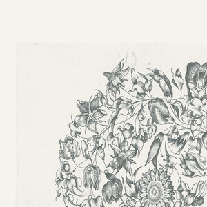 May include: A black and white illustration of a floral design with various flowers and leaves. The design is in a circular shape and features a sunflower, a tulip, and other flowers.