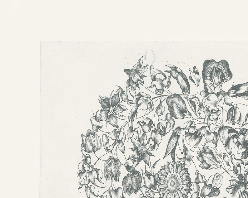 May include: A black and white illustration of a floral design with various flowers and leaves. The design is in a circular shape and features a sunflower, a tulip, and other flowers.