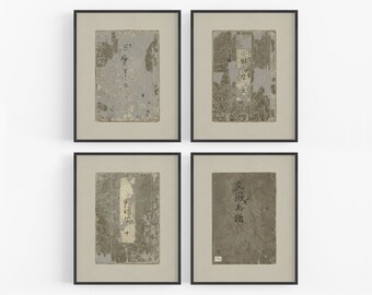 May include: Four framed prints of antique book covers with Japanese text. The covers are worn and faded, with some pages missing. The frames are black and the mats are a light beige.