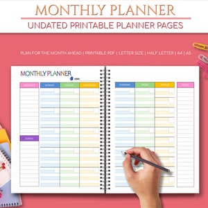 May include: A monthly planner with a colorful design. The planner has sections for birthdays, events, and each day of the week. The planner is undated and printable.