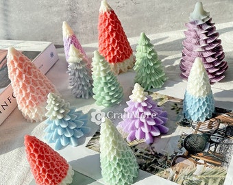 May include: A collection of 12 colorful, hand-painted, miniature Christmas tree ornaments. The ornaments are made of a smooth, glossy material and feature a variety of colors, including pink, purple, blue, green, and red.