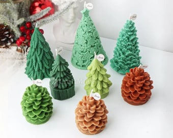 May include: A set of eight Christmas tree and pine cone shaped candles. The candles are green and brown and have a textured surface.